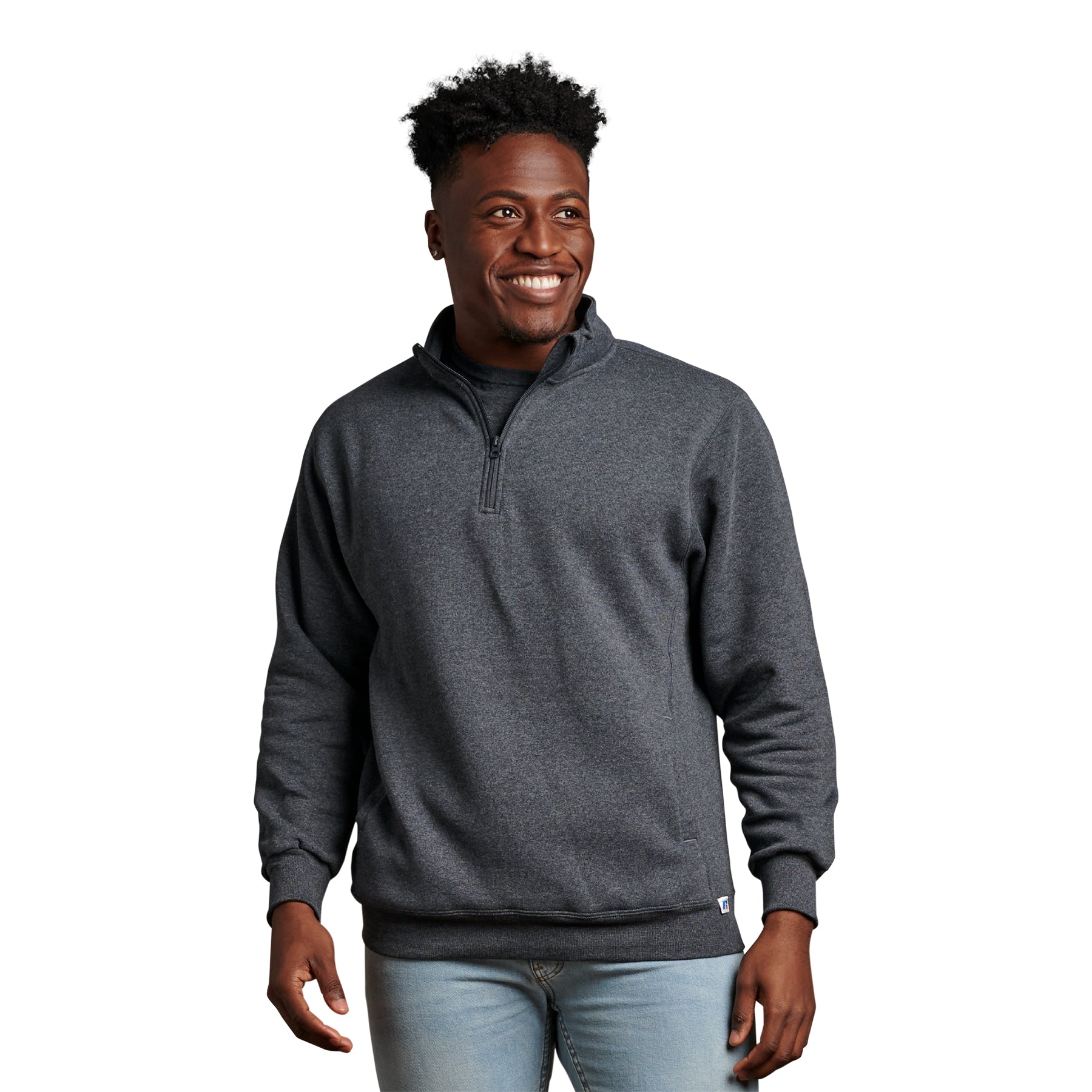 A man wearing a black heather Russell Athletic DRI-POWER Fleece Quarter-Zip Cadet sweater.