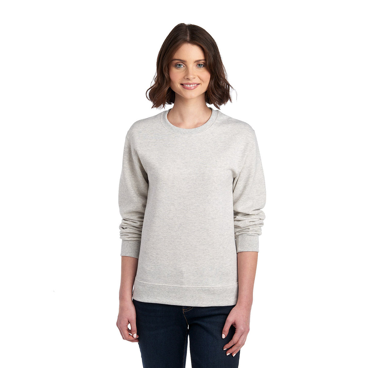 Woman wearing a Jerzees NuBlend® Adult Sweatshirt in Oatmeal Heather.