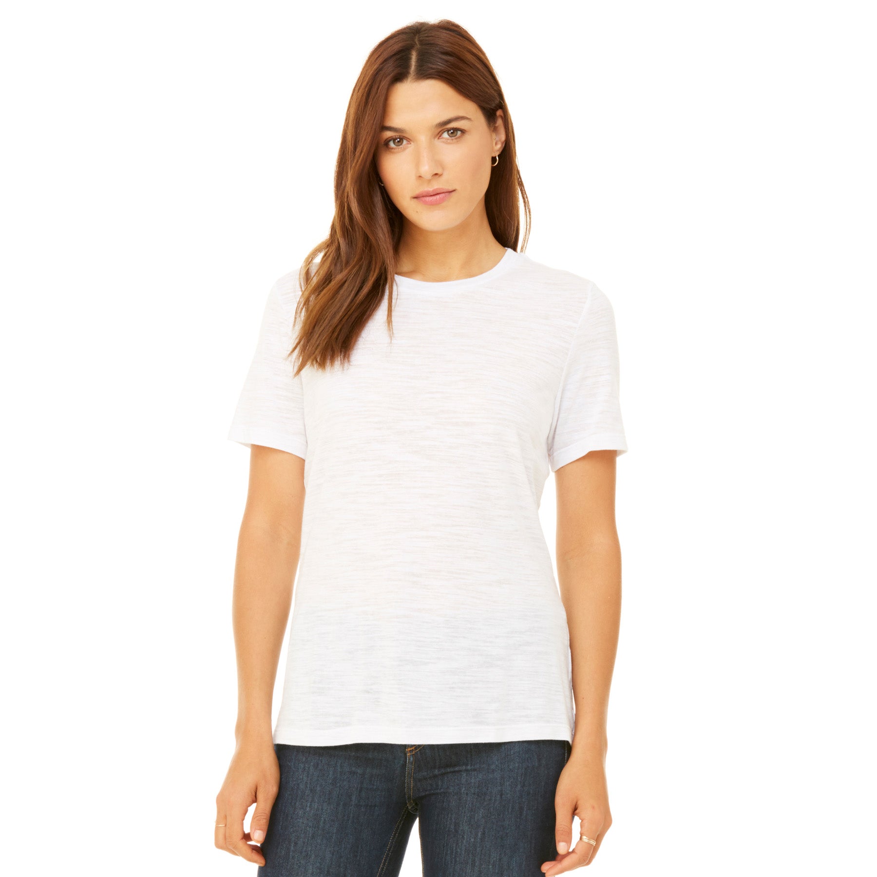 Woman wearing a Bella+Canvas Women's Relaxed Jersey Short Sleeve Tee in white against a white background.