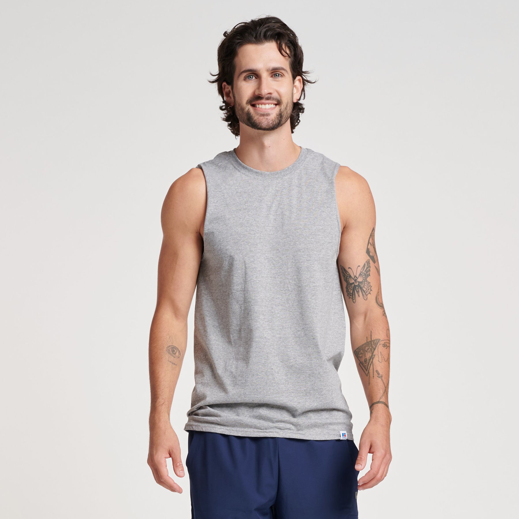 Russell Athletic DRI-POWER CVC Performance unisex muscle t-shirt in Oxford gray worn by a model.