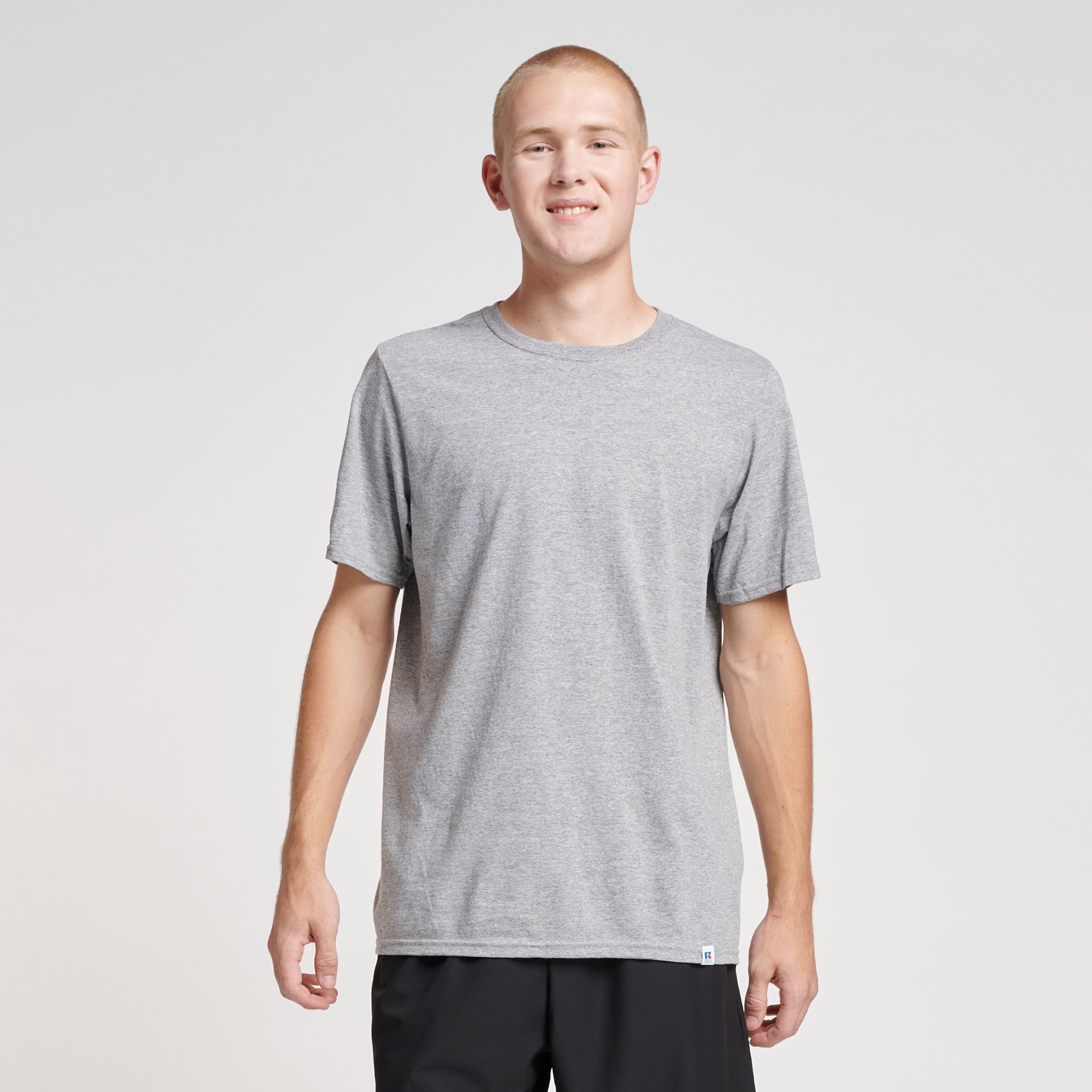 Russell Athletic DRI-POWER CVC Performance unisex T-shirt in Oxford gray worn by a model.