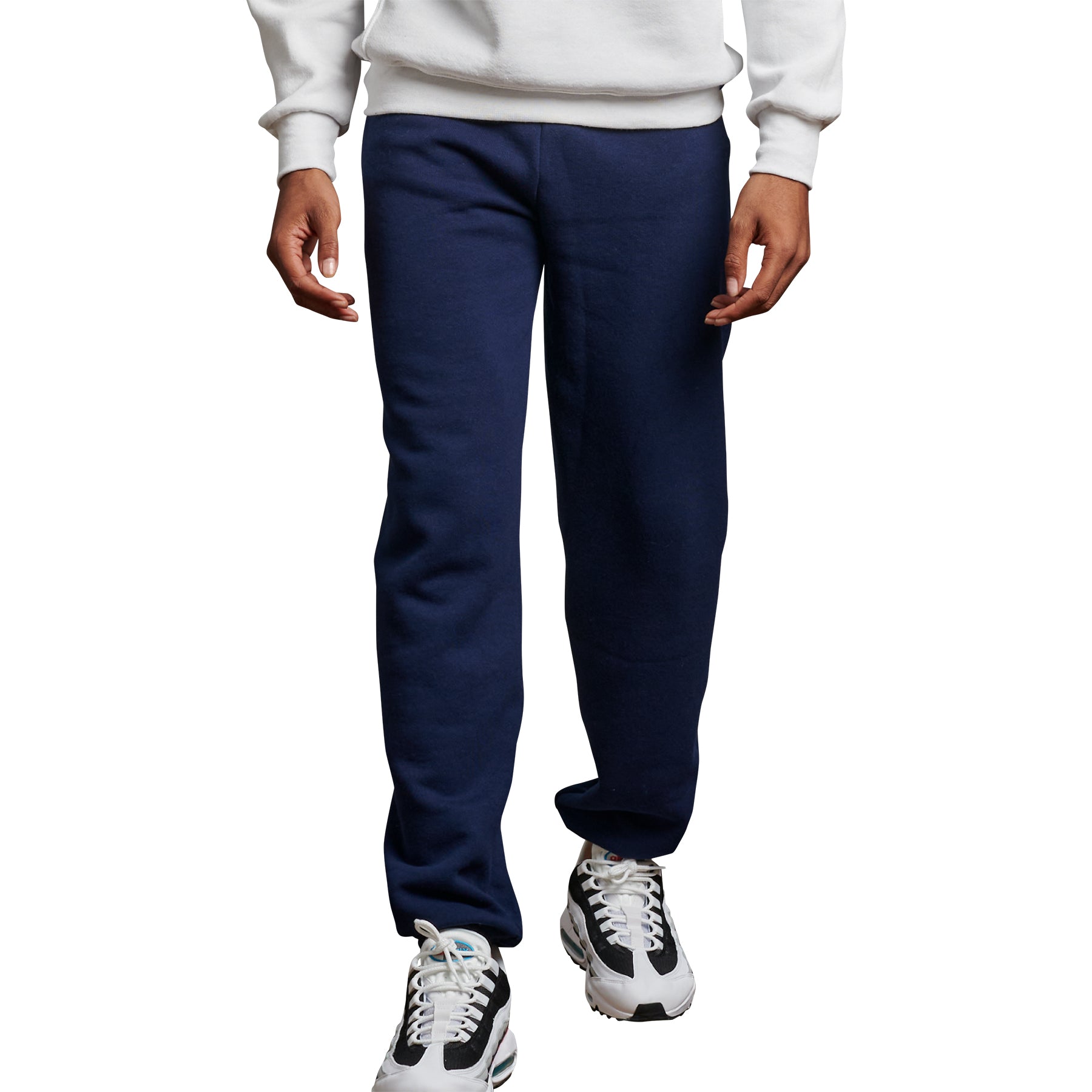 A model wearing Russell Athletic DRI-POWER Adult Closed-Bottom sweatpants in navy.