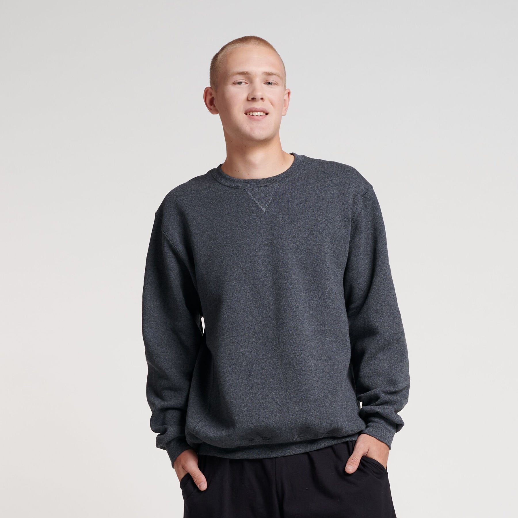 Man wearing a Russell Athletic DRI-POWER Adult Fleece Crew sweatshirt in black heather.