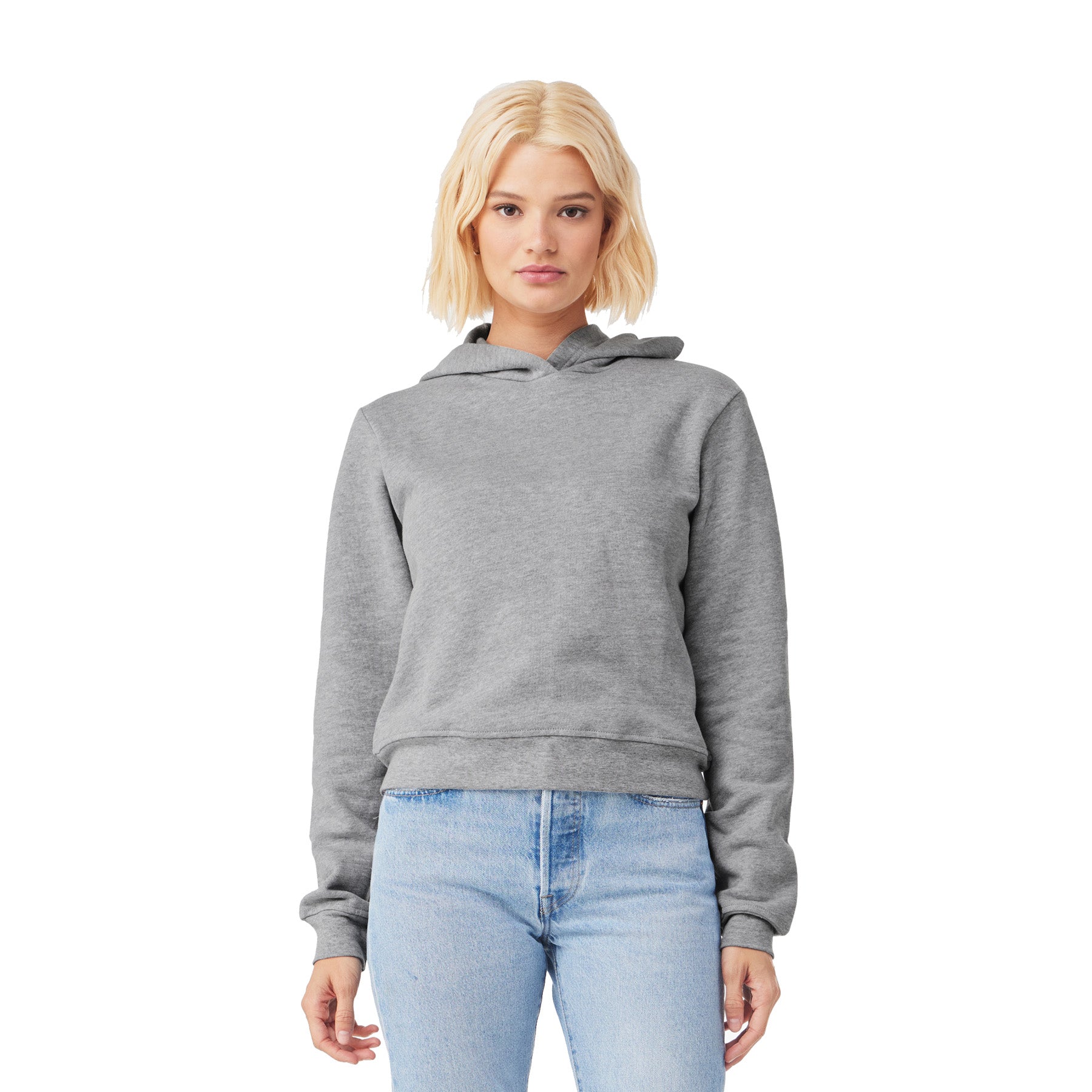 A woman wearing a Bella+Canvas Women's Classic Pullover Hoodie in Athletic Heather.