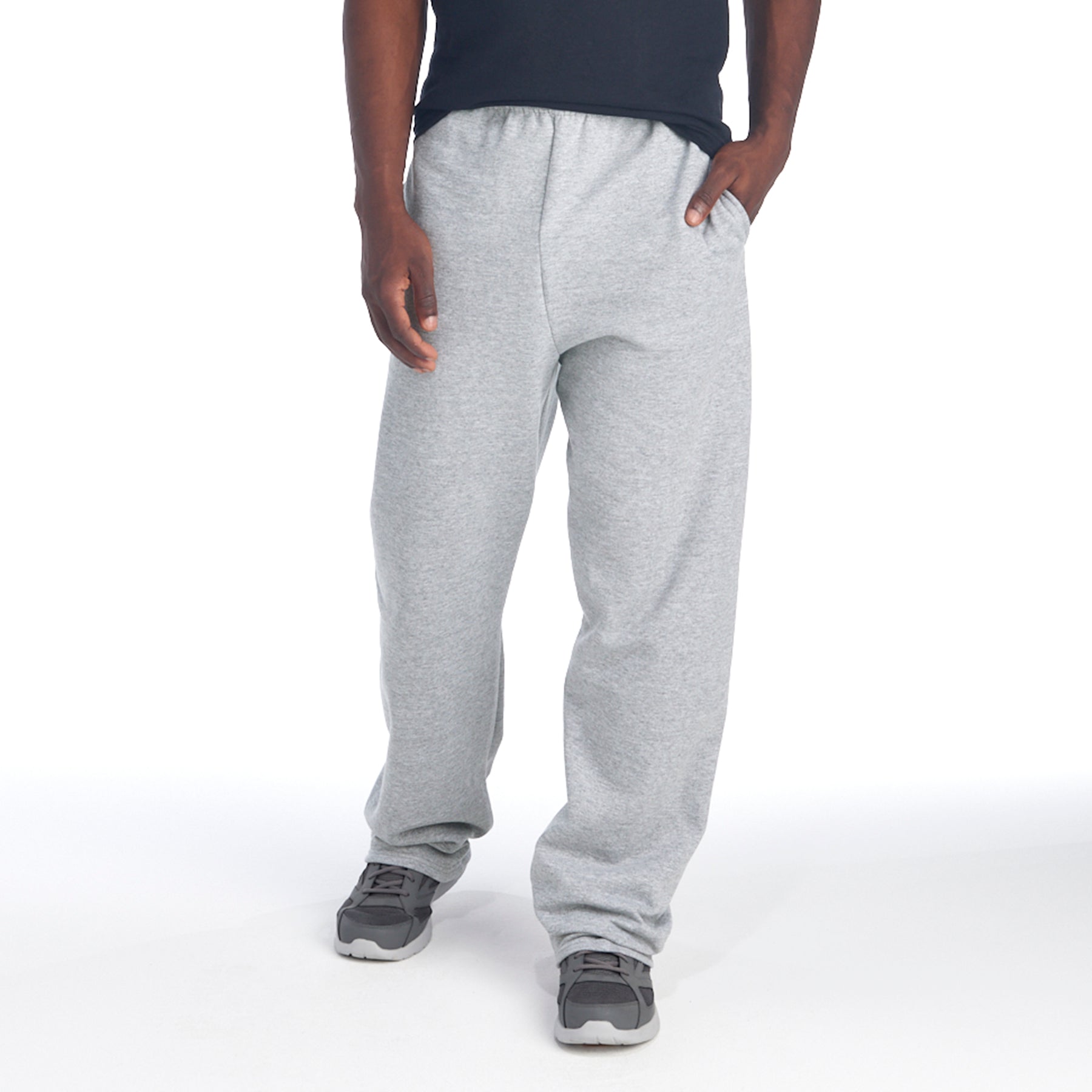 Jerzees NuBlend Athletic Heather pocketed open-bottom sweatpants on a man.