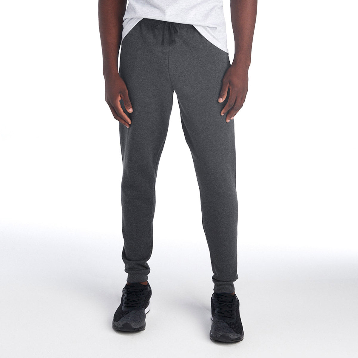 Jerzees NuBlend Adult Pocketed Jogger Sweatpants in Black Heather worn by a person with black athletic shoes.