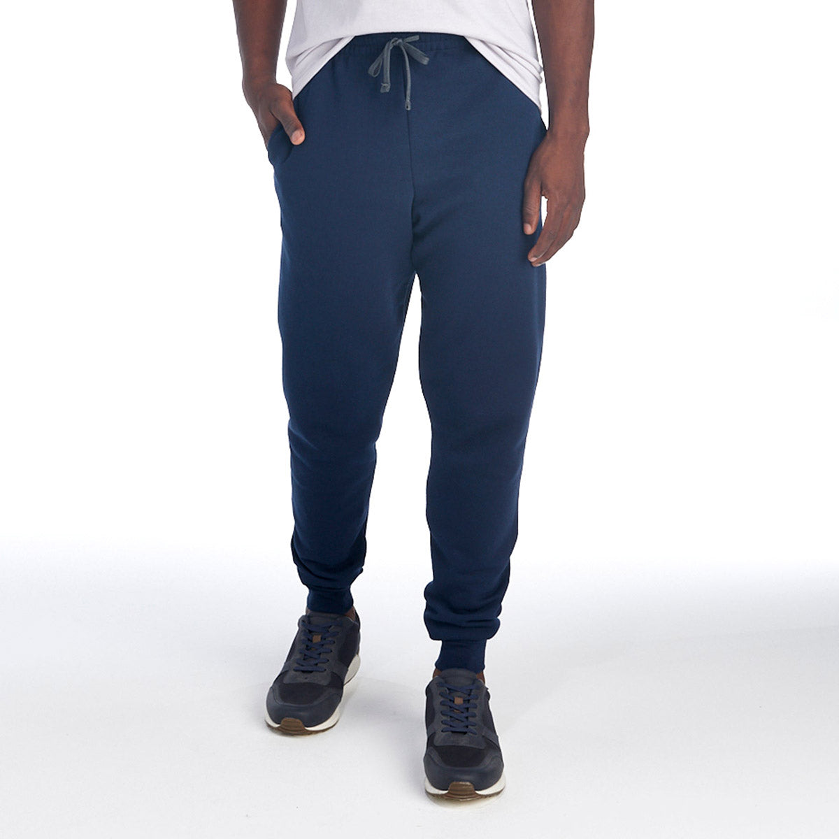 Jerzees NuBlend Adult Pocketed Jogger Sweatpants in J. Navy worn by a man with sneakers.