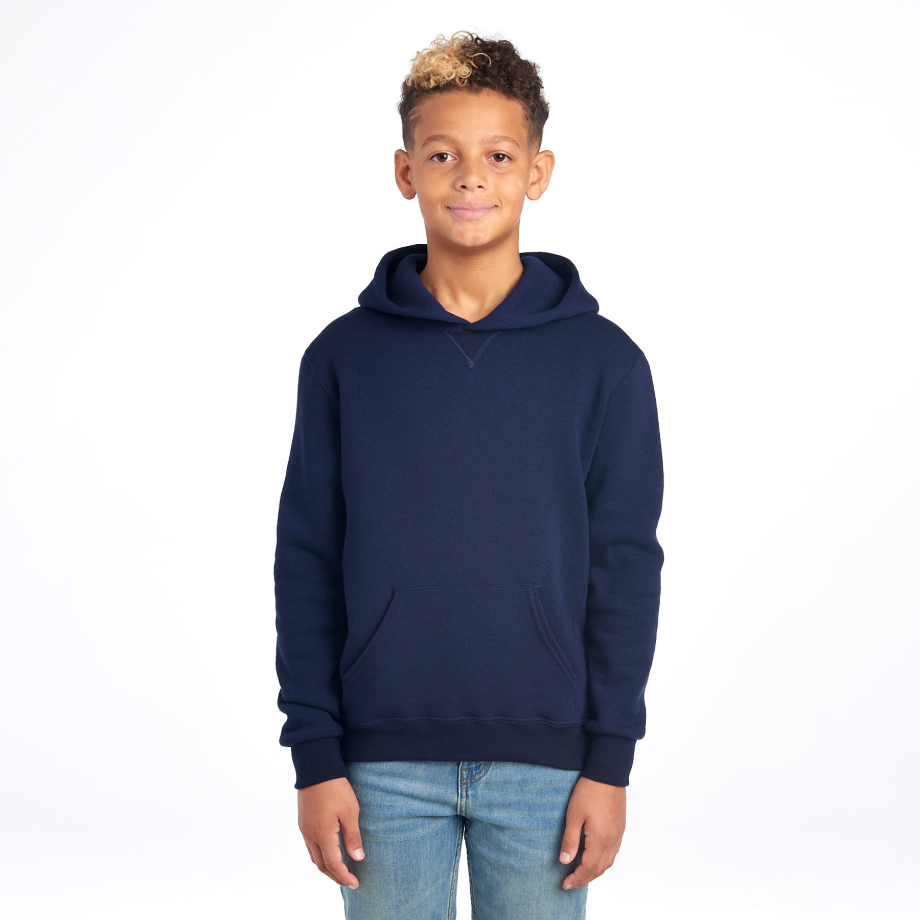 Young boy wearing a Russell Athletic DRI-POWER Youth Fleece Pullover Hoodie in navy.