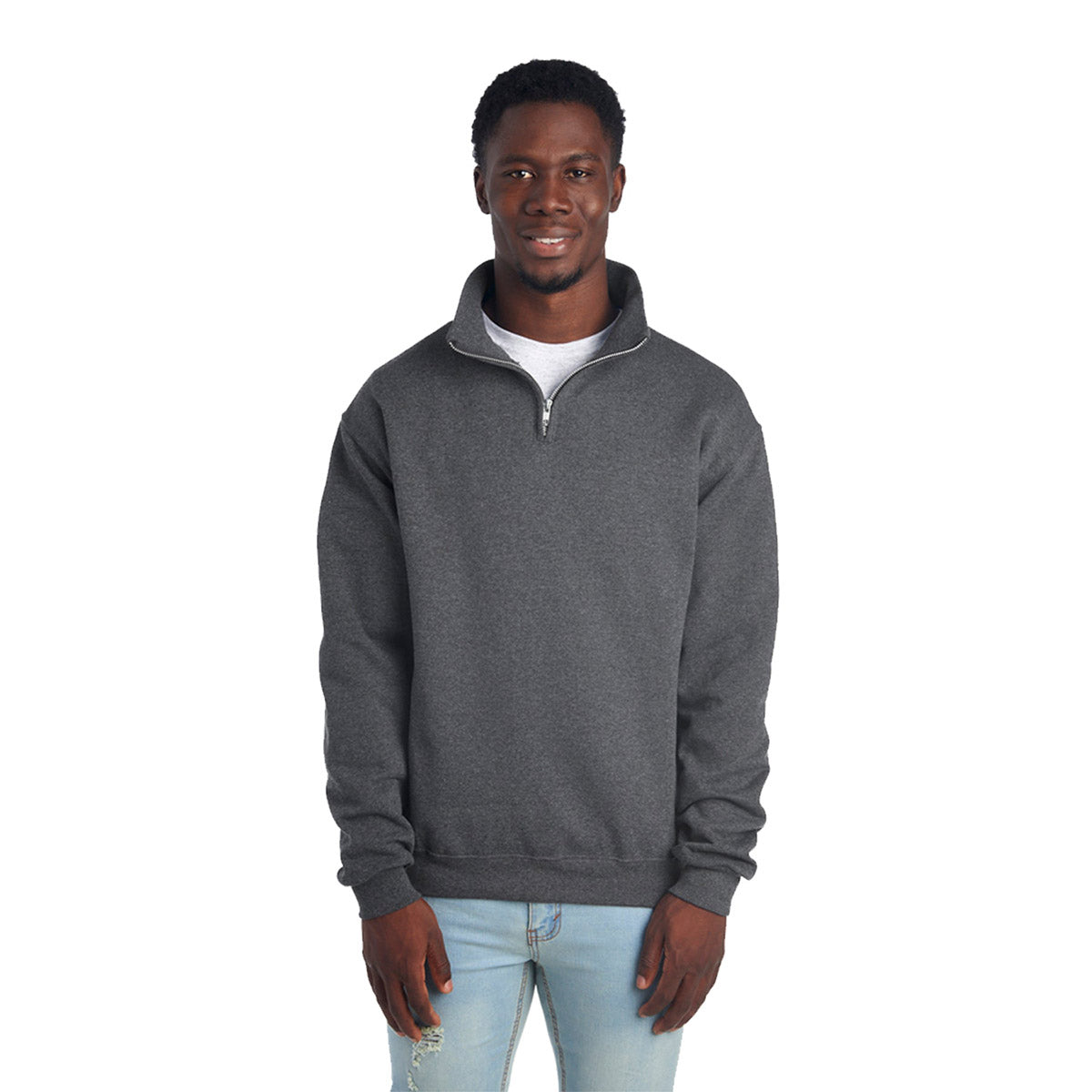 A man wears a Jerzees NuBlend unisex quarter-zip cadet collar sweatshirt in black heather.