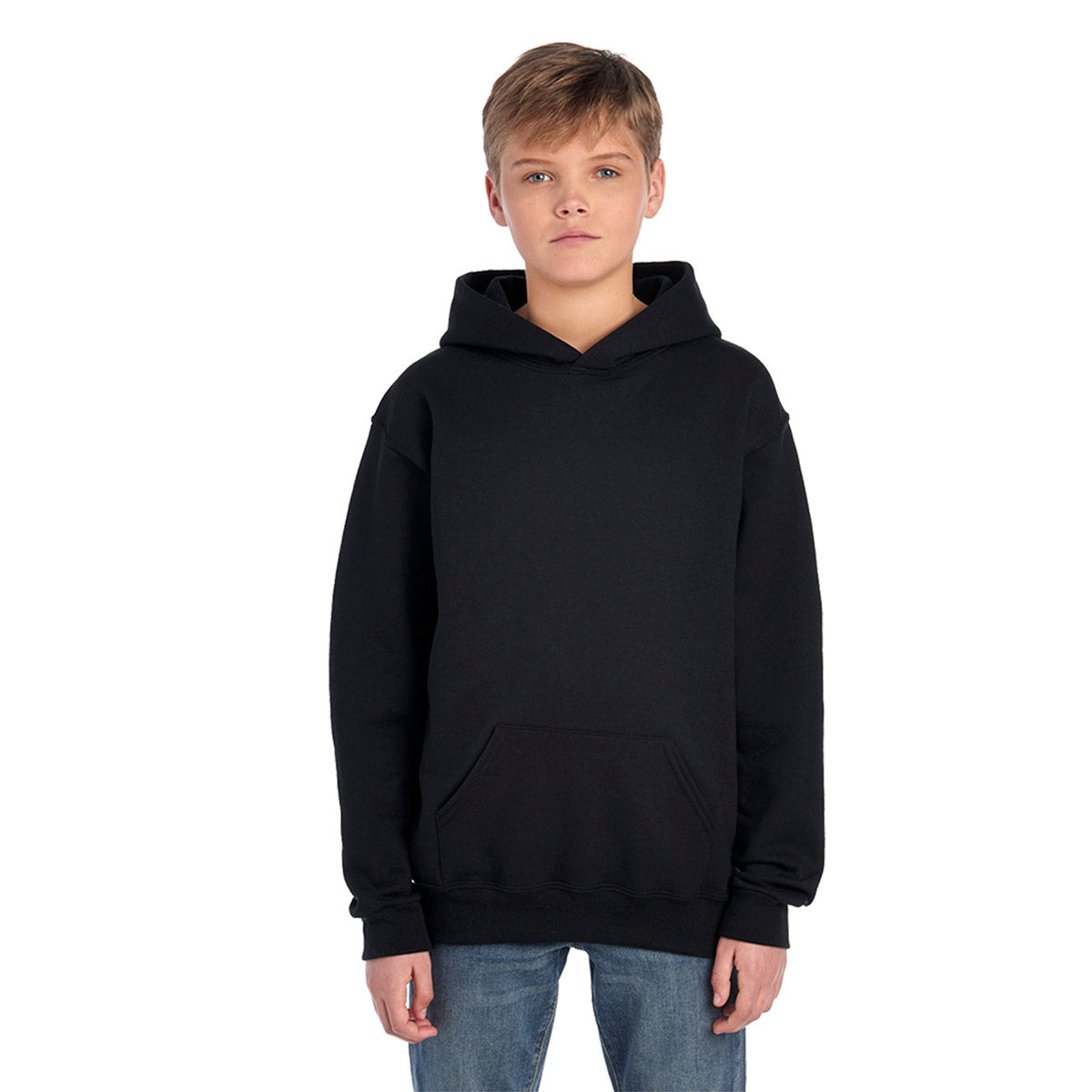 A young boy wearing a black Jerzees NuBlend® Youth Hooded Sweatshirt against a plain white background.
