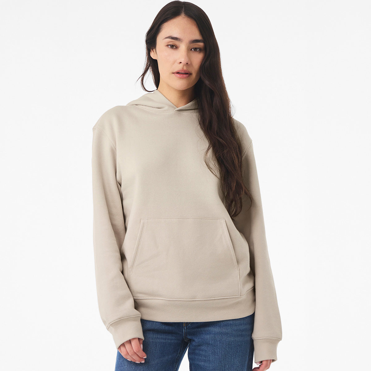 Model wearing a Bella + Canvas Unisex 10 oz Heavyweight Pullover Hoodie in Dust color.