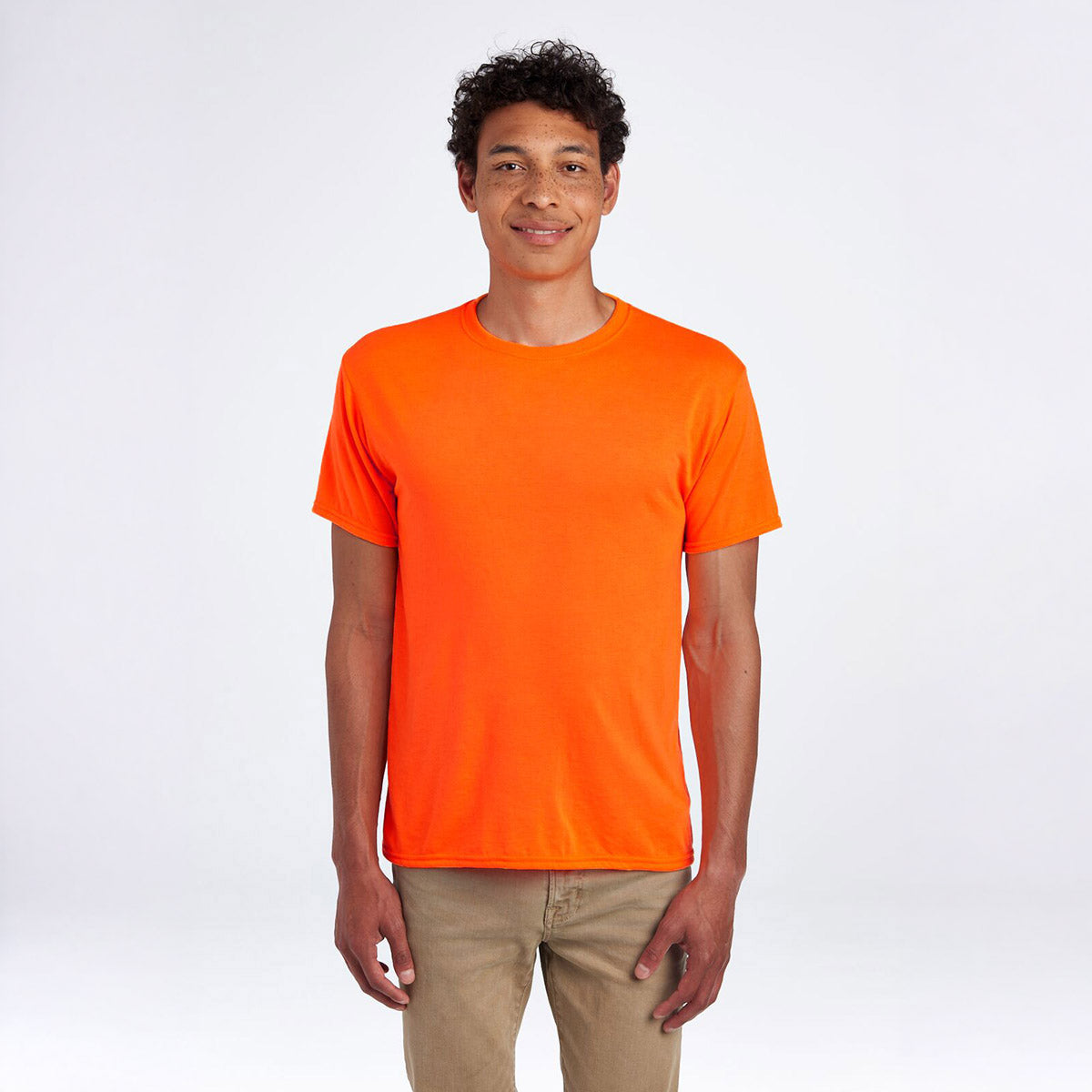 Man wearing a Jerzees Dri-Power unisex T-shirt in safety orange against a white background.
