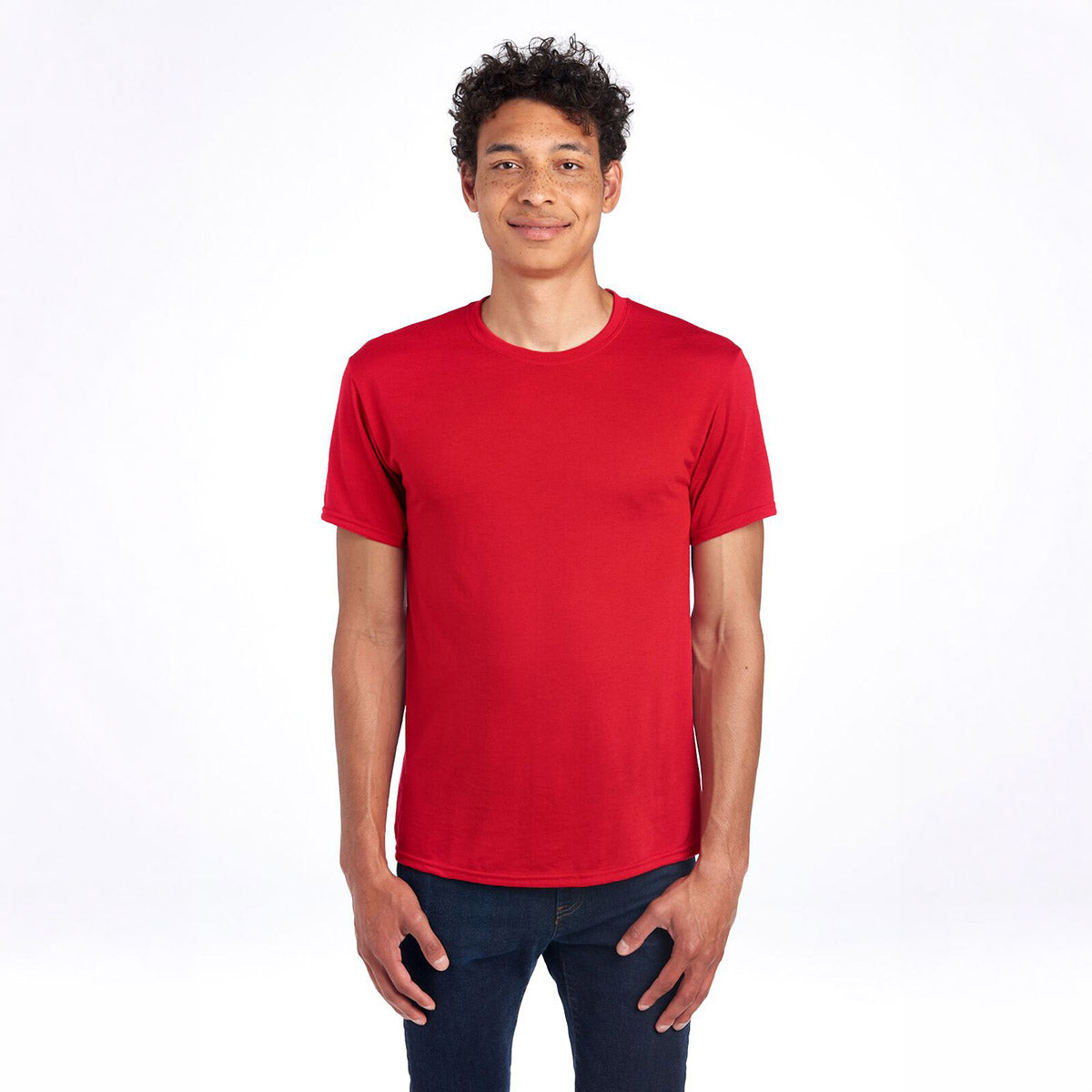 A person wearing a Jerzees Dri-Power unisex T-shirt in True Red.