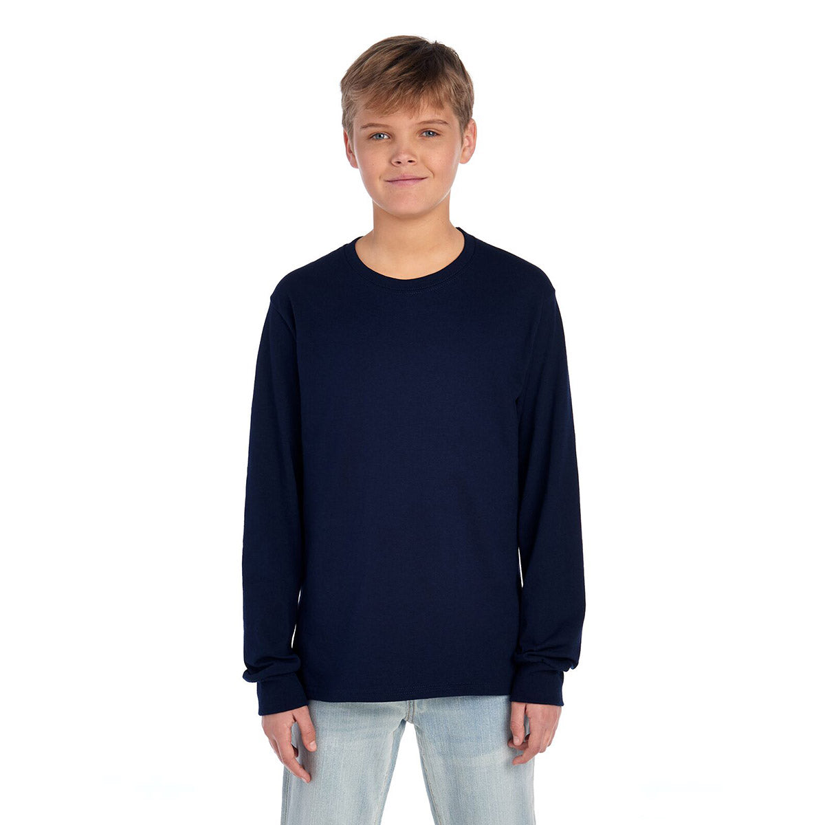 A youth model wearing a Jerzees Dri-Power long-sleeve T-shirt in J. Navy.