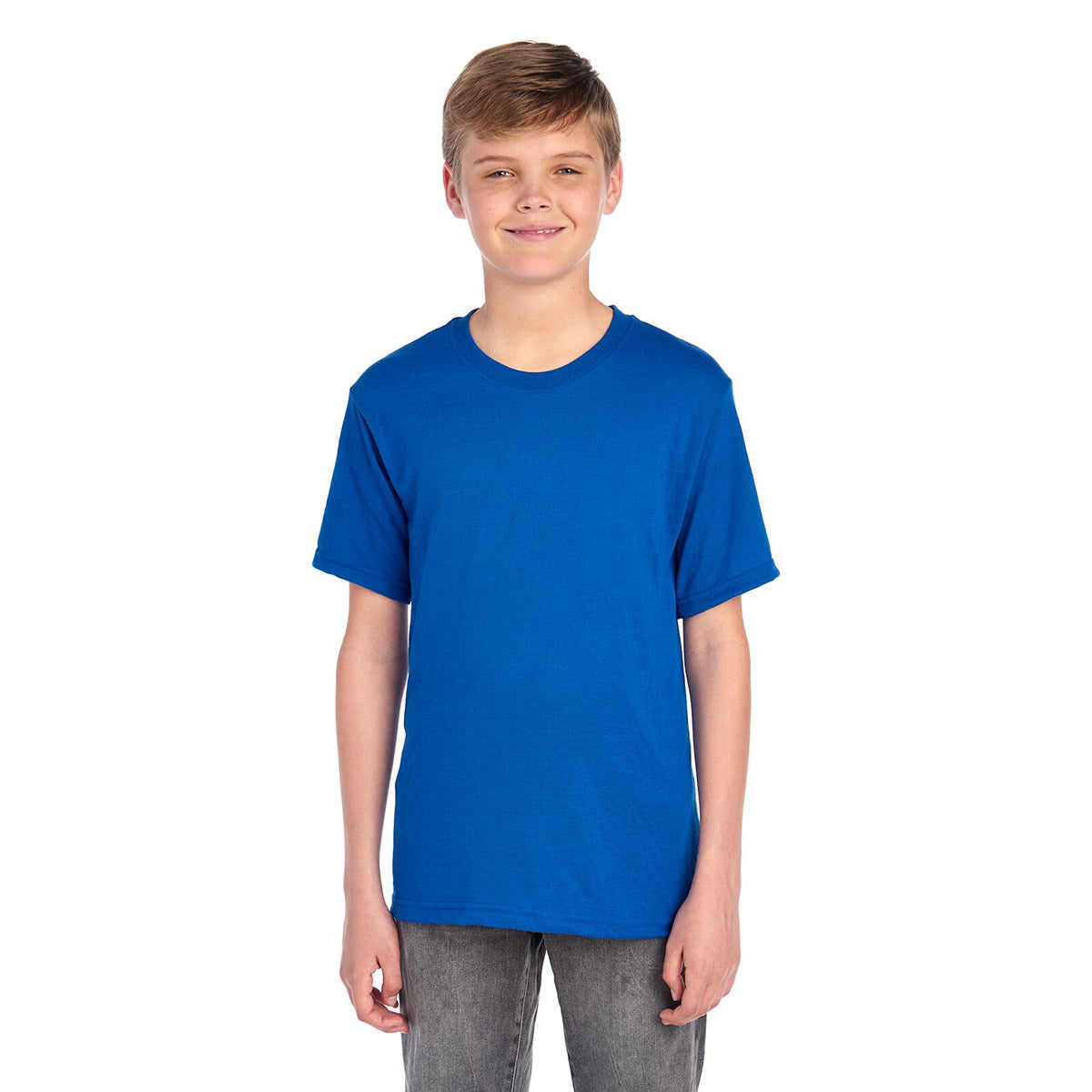 A young boy wearing a royal blue Jerzees Dri-Power Youth T-Shirt against a white background.
