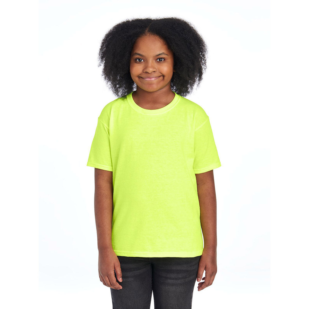 A young girl wearing a Safety Green Jerzees Dri-Power Youth T-Shirt standing against a white background.