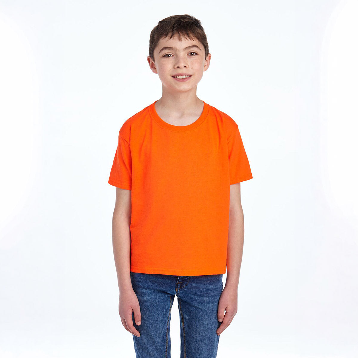 A young boy wearing a Jerzees Dri-Power youth T-shirt in safety orange.