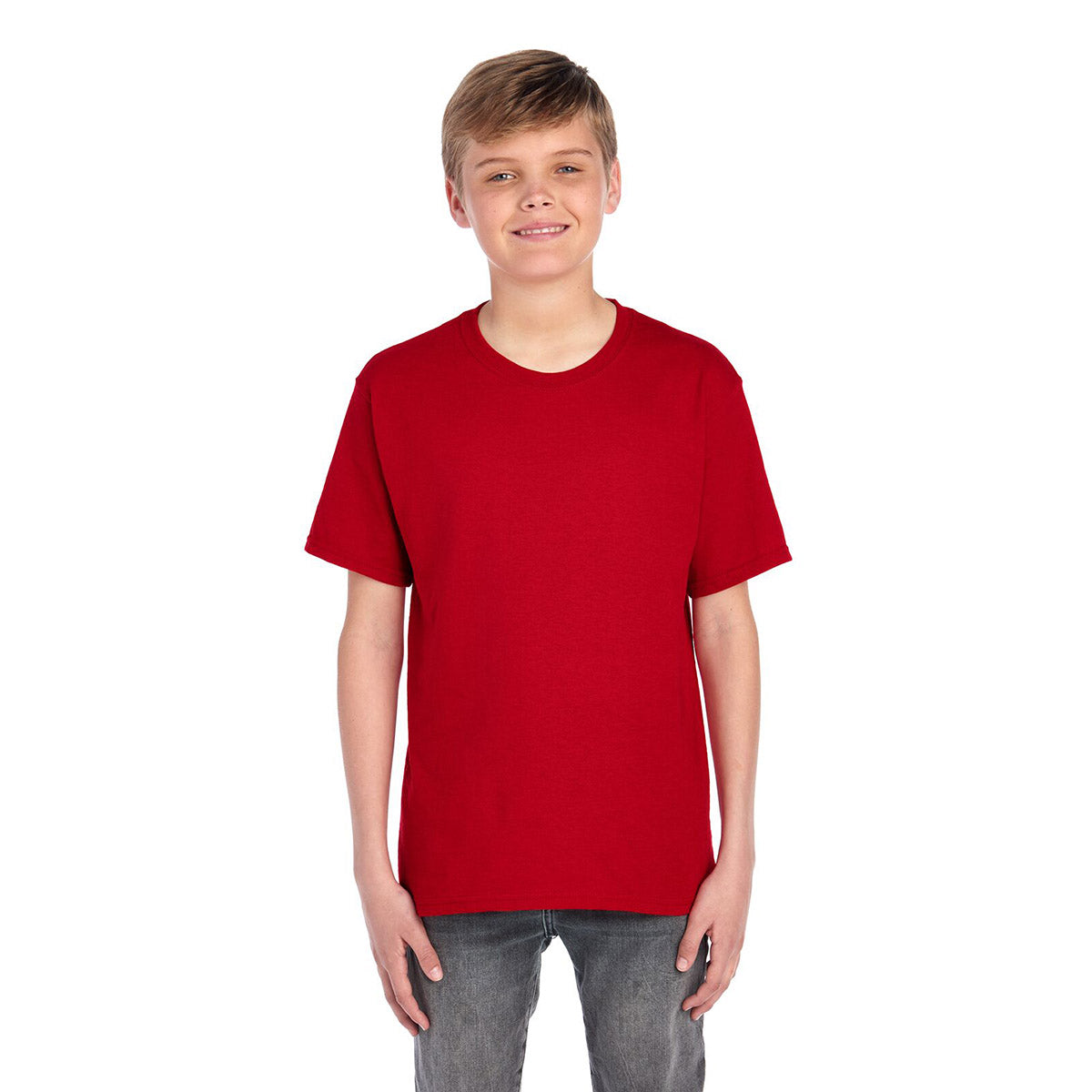 A young boy wearing a True Red Jerzees Dri-Power Youth T-Shirt against a plain white background.