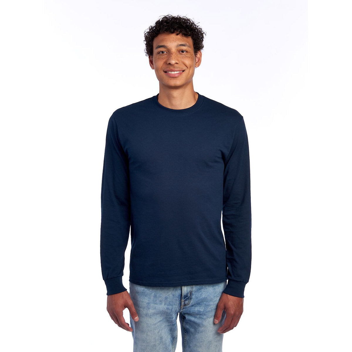 A model wearing a Jerzees Dri-Power unisex long-sleeve T-shirt in J. Navy.
