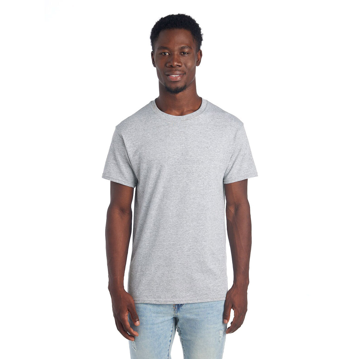A smiling man wearing a Jerzees Dri-Power Unisex T-Shirt in Athletic Heather.