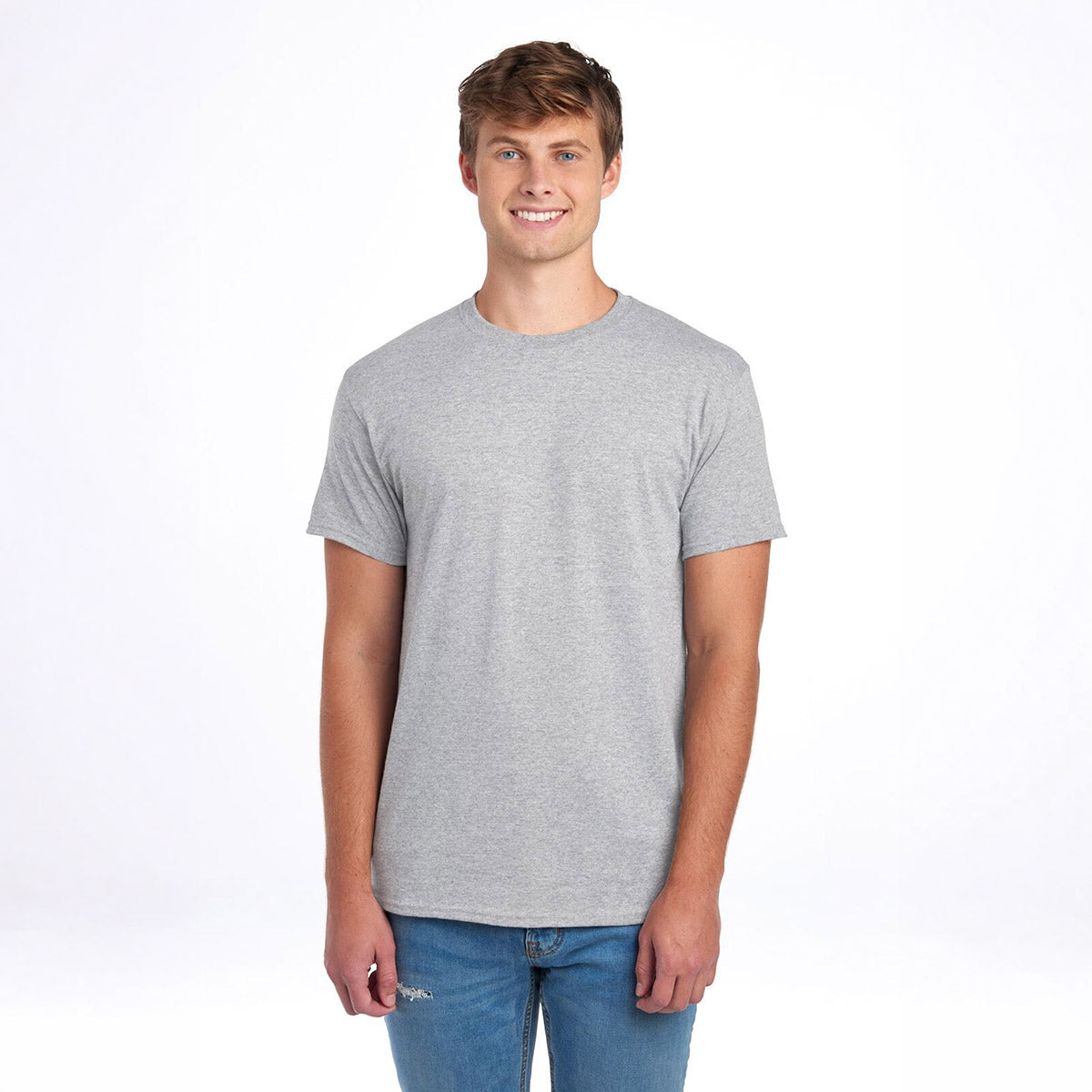 A smiling man wearing a gray Jerzees Dri-Power Unisex T-Shirt in Oxford color against a white background.