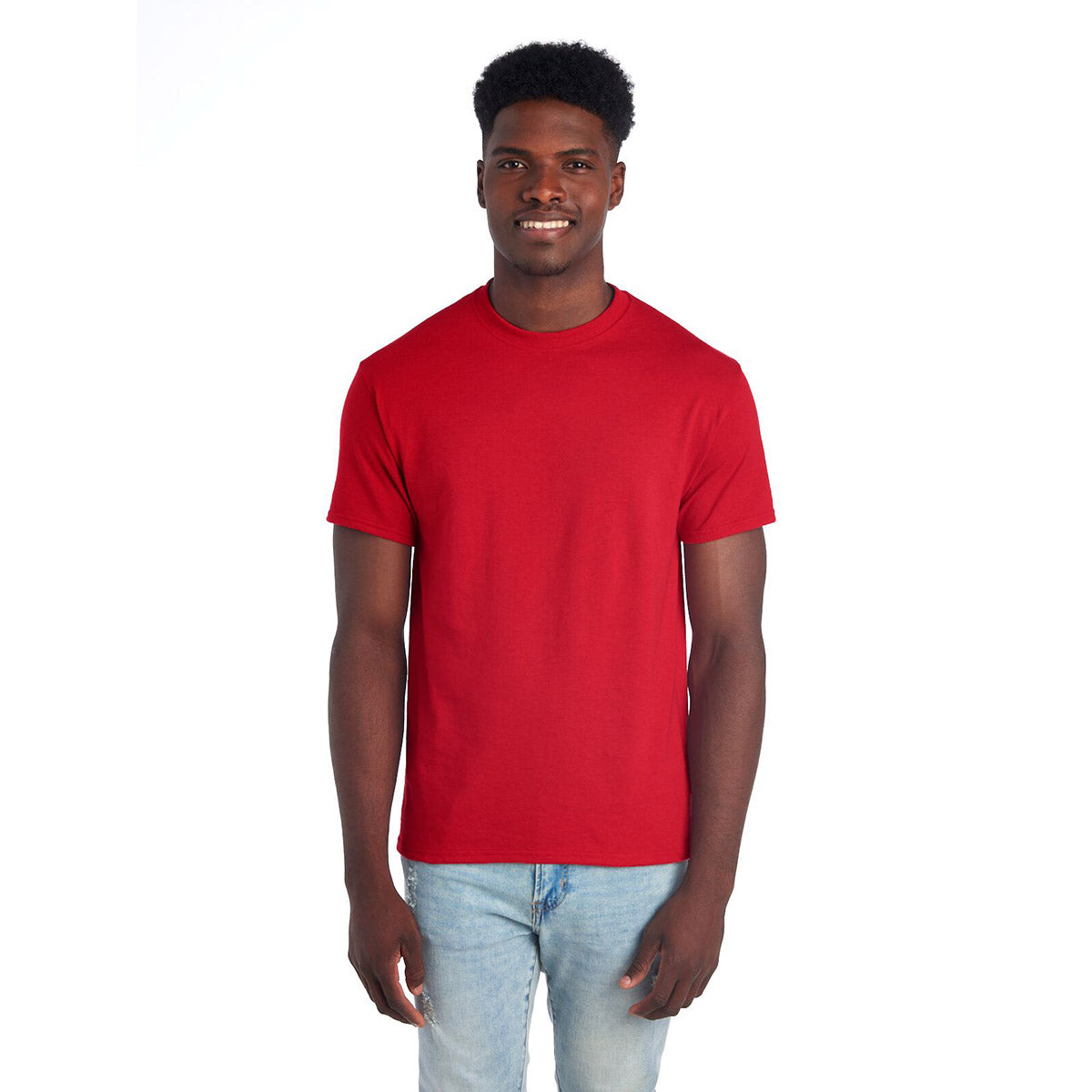 A man wearing a True Red Jerzees Dri-Power Unisex T-Shirt against a white background.
