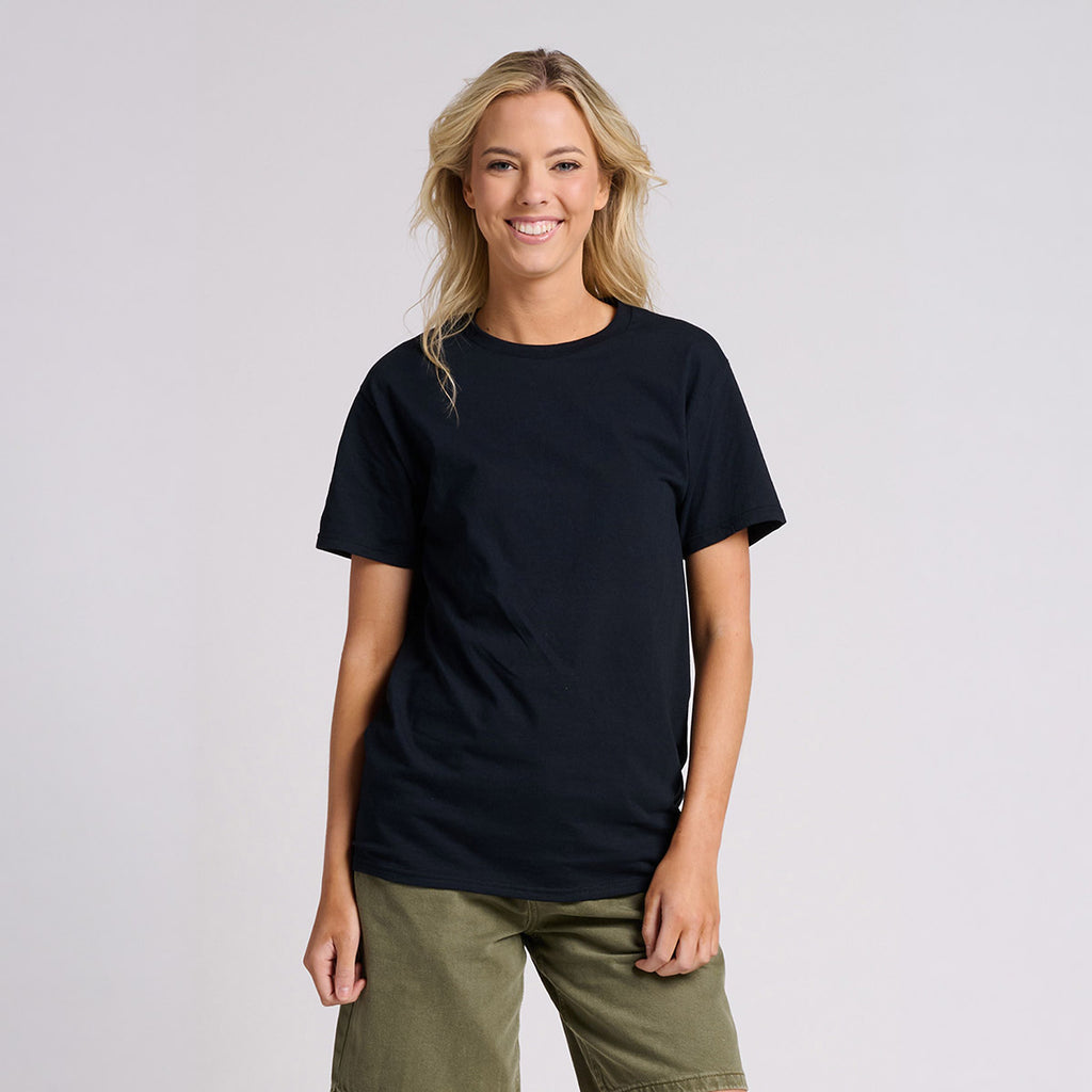A blonde woman wearing a Jerzees Classics Unisex T-Shirt in black ink paired with olive green shorts.