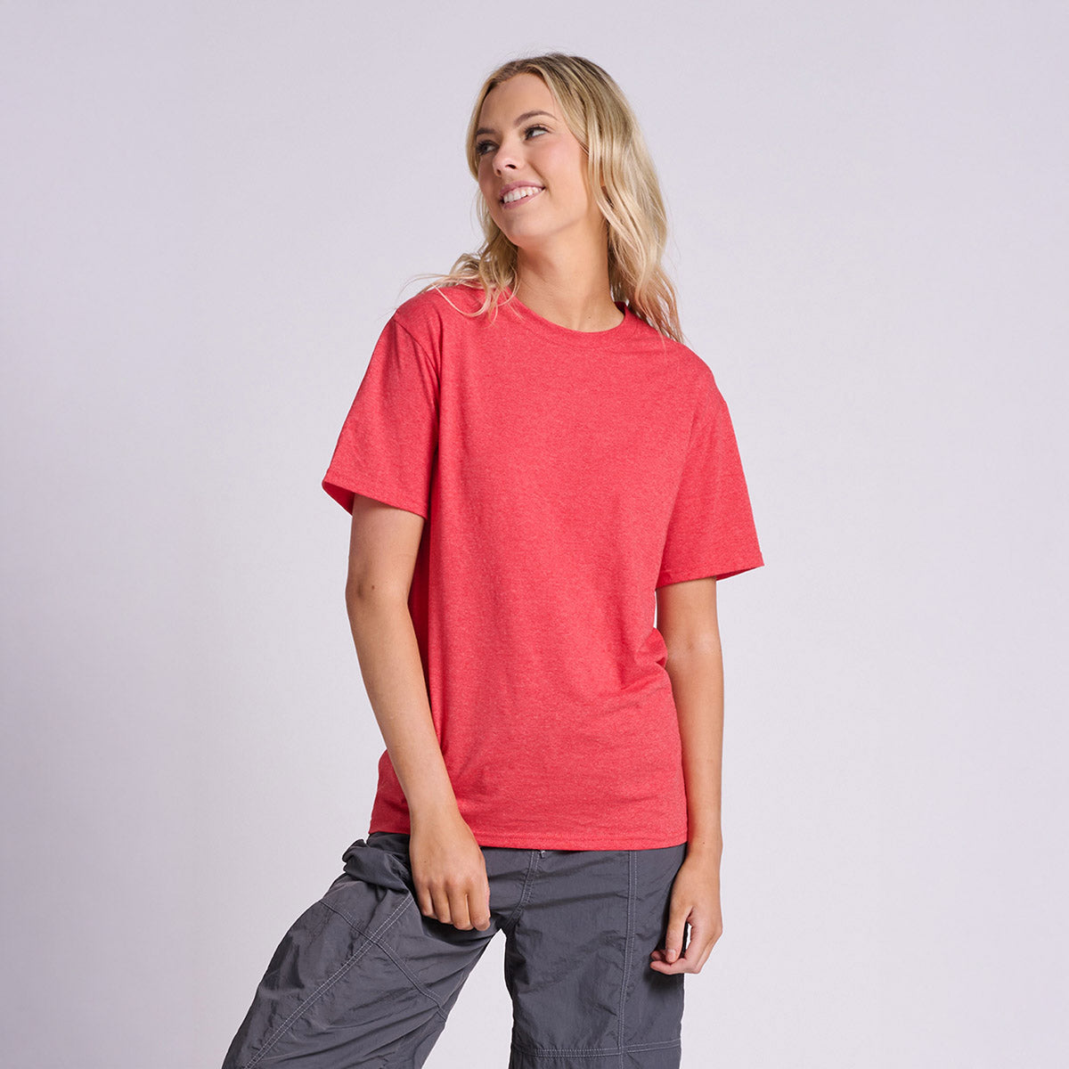 Woman wearing a Fiery Red Heather Jerzees Classics unisex t-shirt.