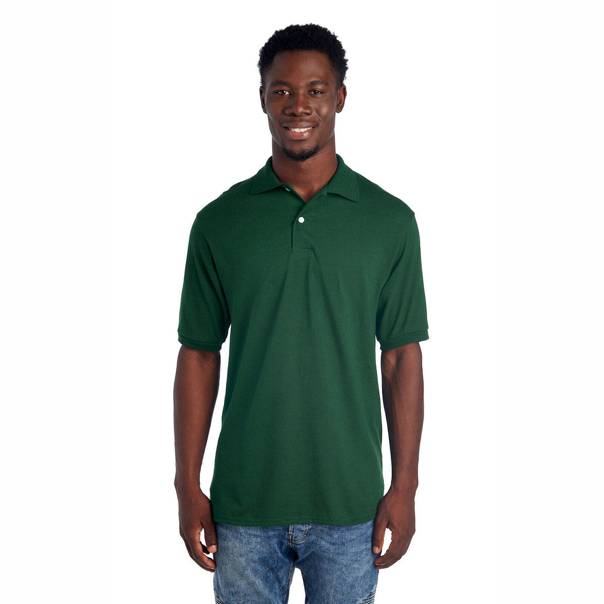 A man wearing a forest green Jerzees Dri-Power Sport Shirt paired with blue jeans.
