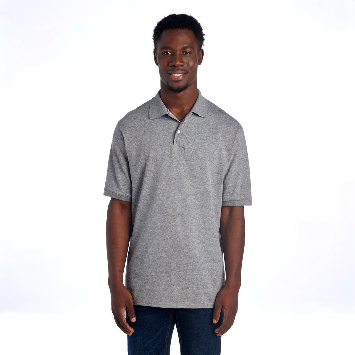 A man wearing a grey Oxford Jerzees Dri-Power Sport Shirt.