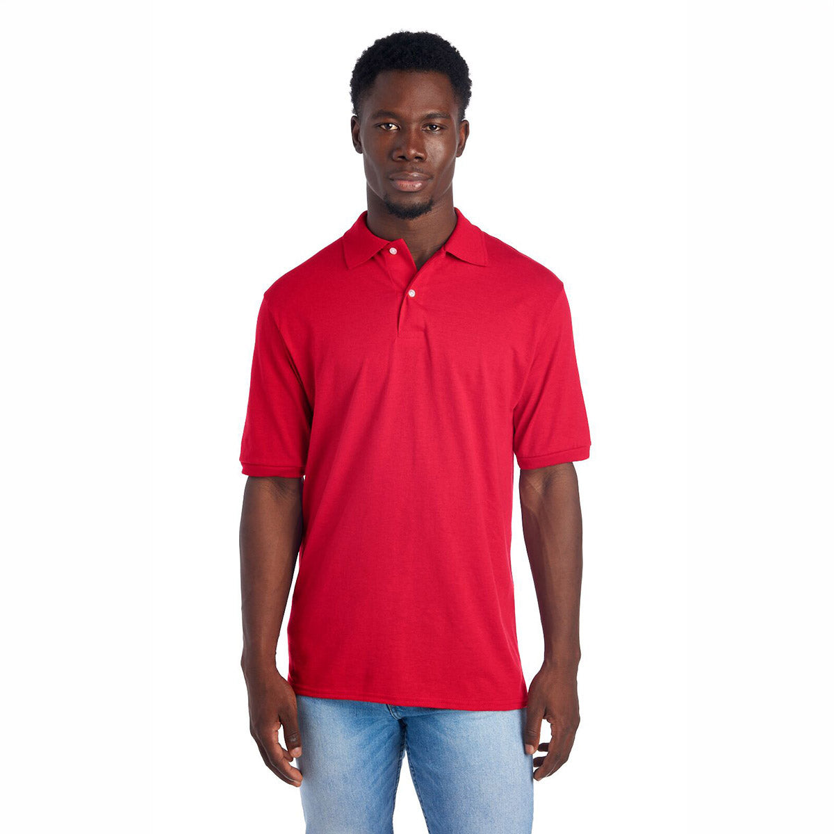 A man wearing a True Red Jerzees Dri-Power Sport Shirt with a collar and white buttons.