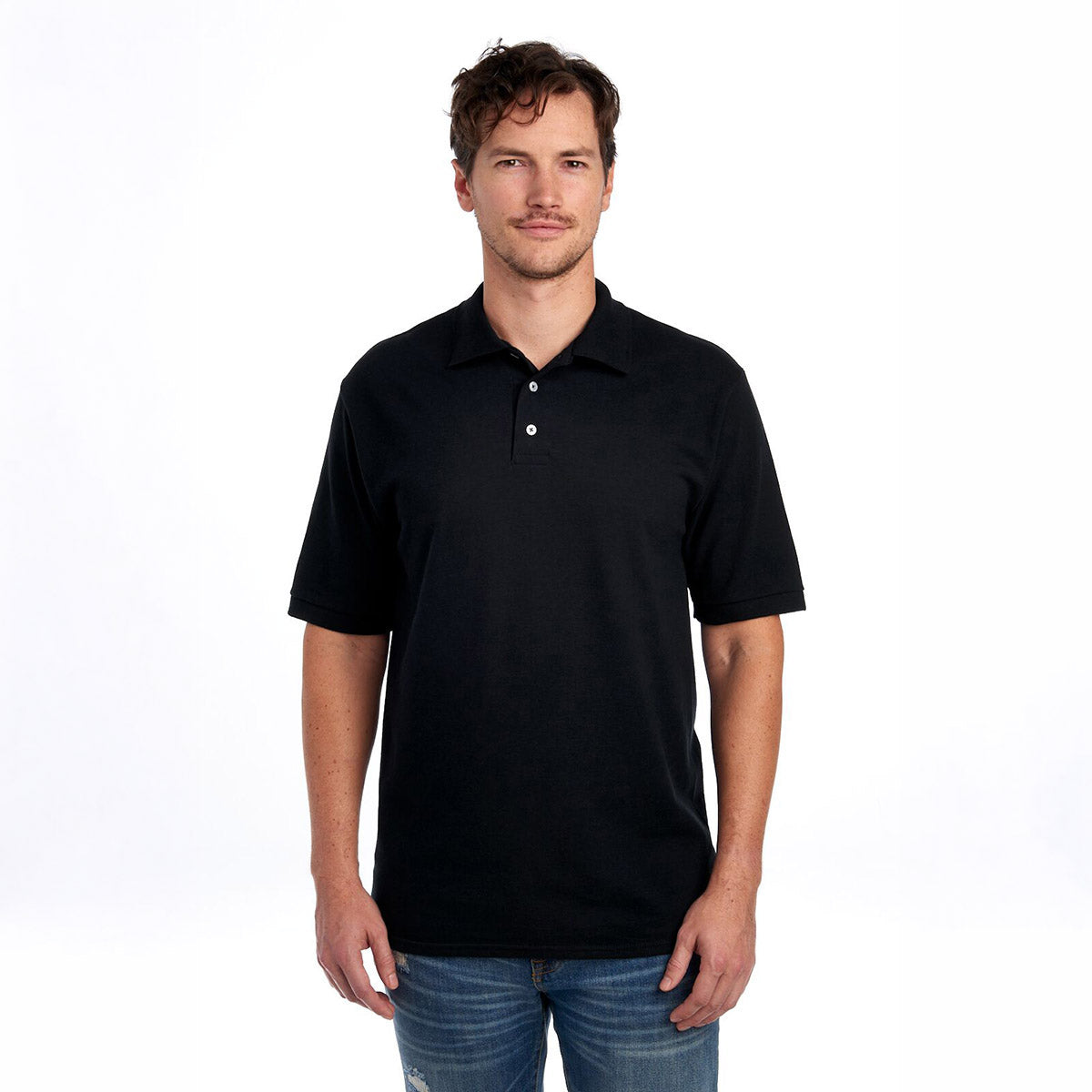A man wearing a black Jerzees Premium Ring-Spun Cotton Pique Sport Shirt against a white background.
