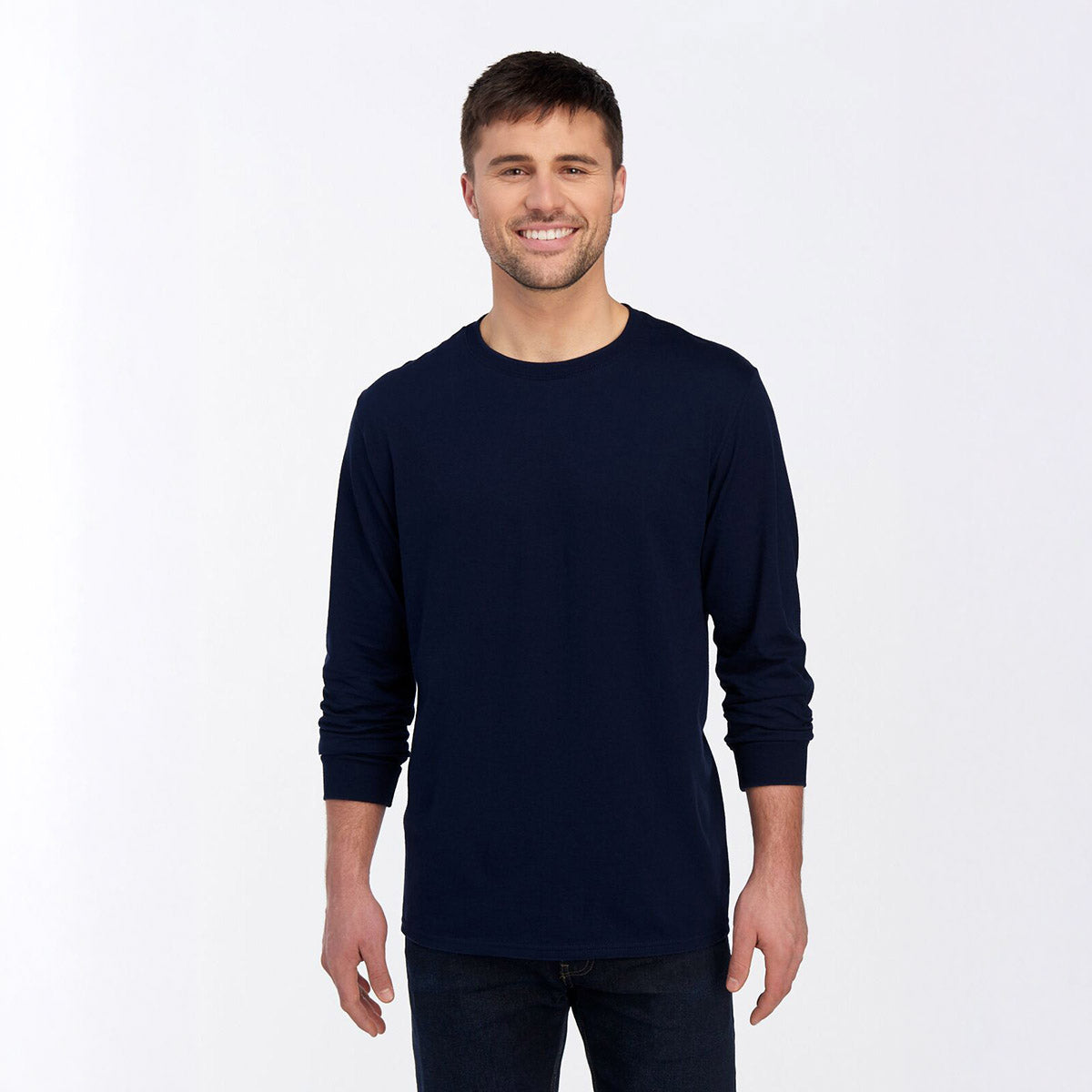 Man wearing a navy blue Jerzees Premium Blend Combed Ring-Spun unisex long-sleeve T-shirt.
