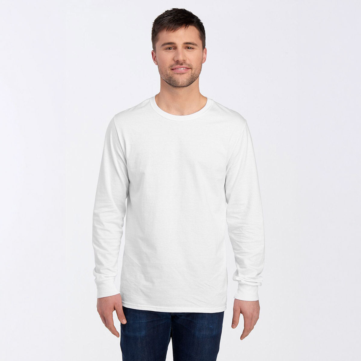 A man wearing a white Jerzees Premium Blend Combed Ring-Spun Unisex Long-Sleeve T-Shirt against a white background.