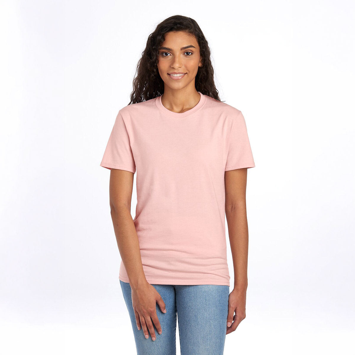 Woman wearing a Jerzees Premium Blend Combed Ring-Spun Unisex T-Shirt in blush pink.