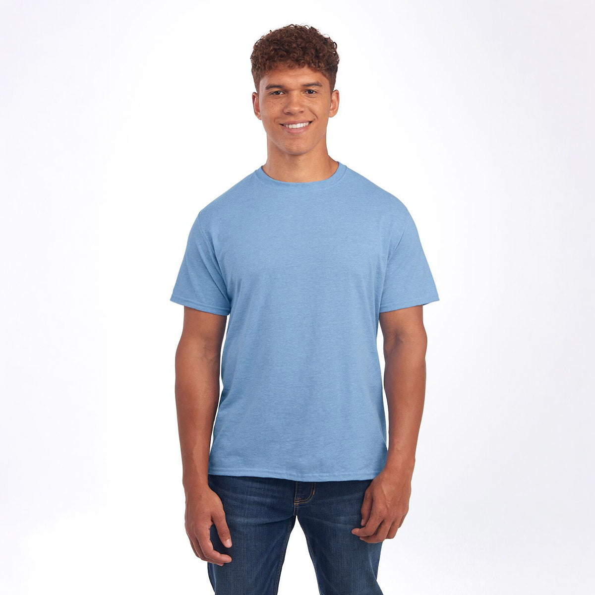 A smiling man wearing a Jerzees Premium Blend Combed Ring-Spun unisex t-shirt in Carolina Heather.