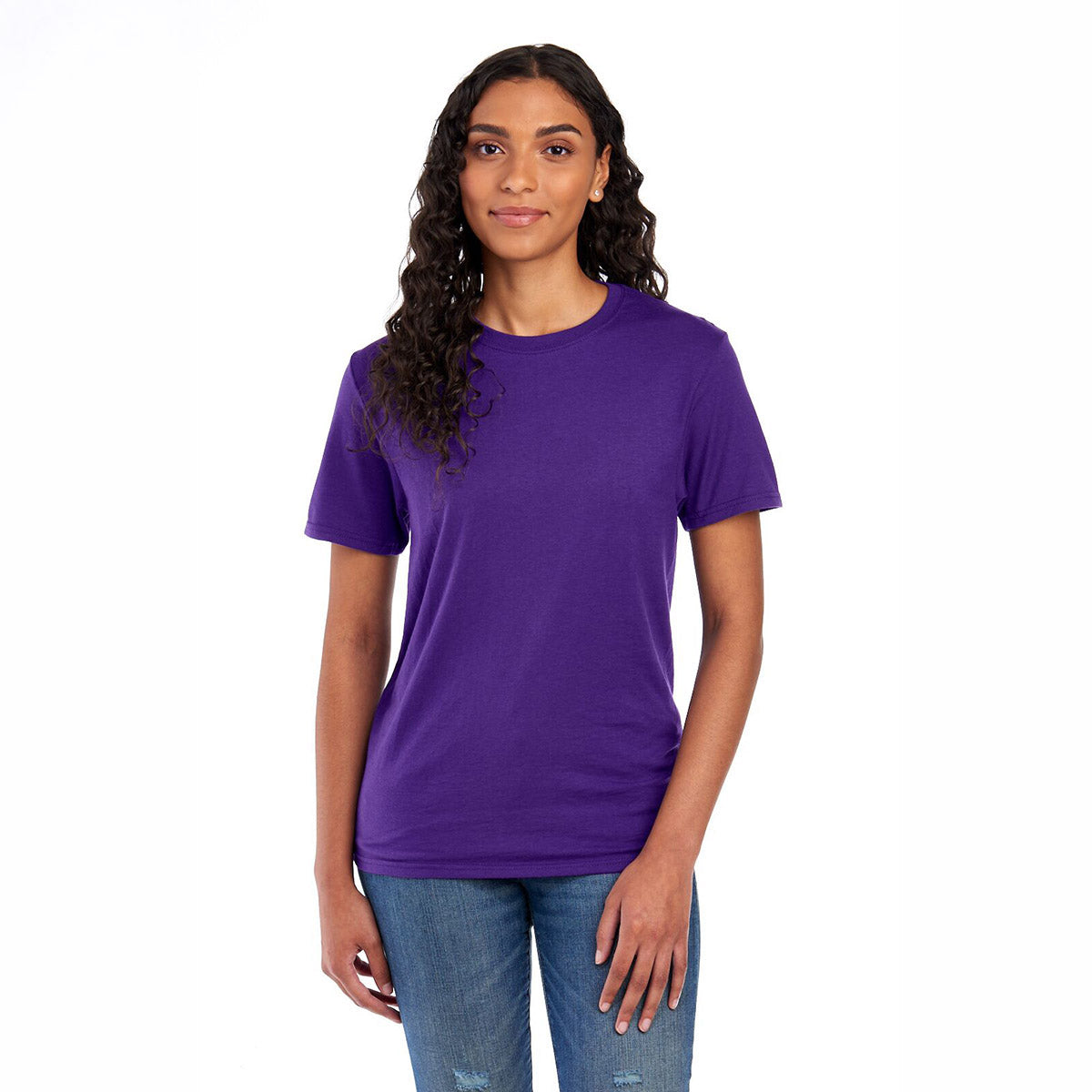 A woman wearing a deep purple Jerzees Premium Blend Combed Ring-Spun unisex t-shirt and blue jeans.