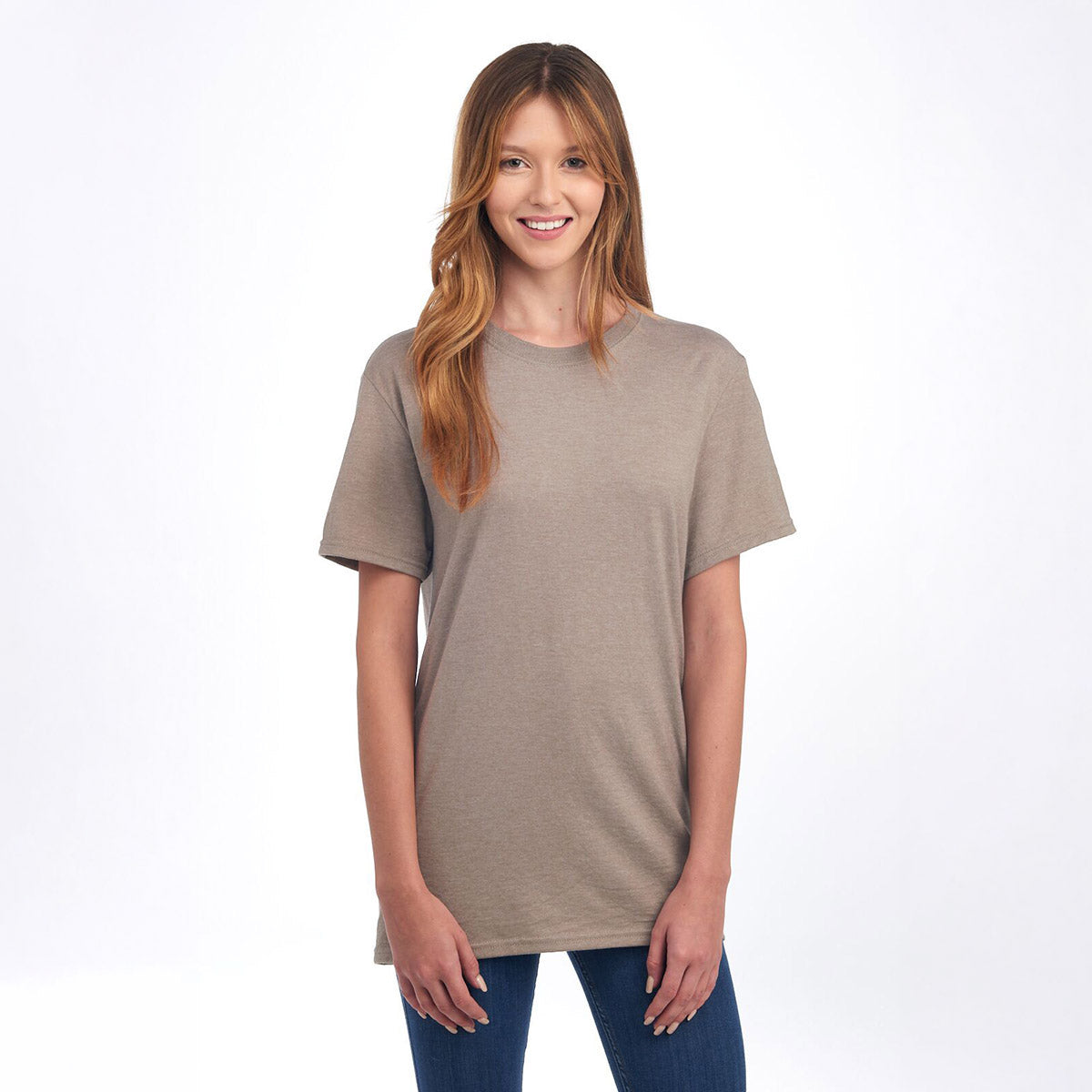 Woman wearing a Taupe Heather Jerzees Premium Blend Combed Ring-Spun unisex T-shirt against a white background.