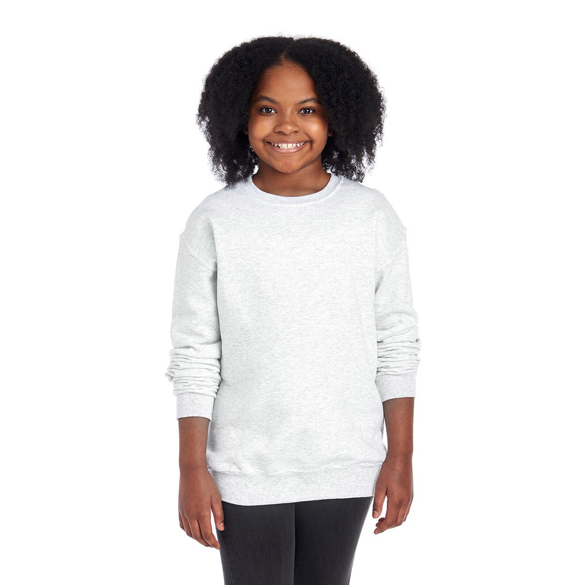 A young girl wearing a Jerzees NuBlend® Youth Sweatshirt in ash gray against a plain white background.