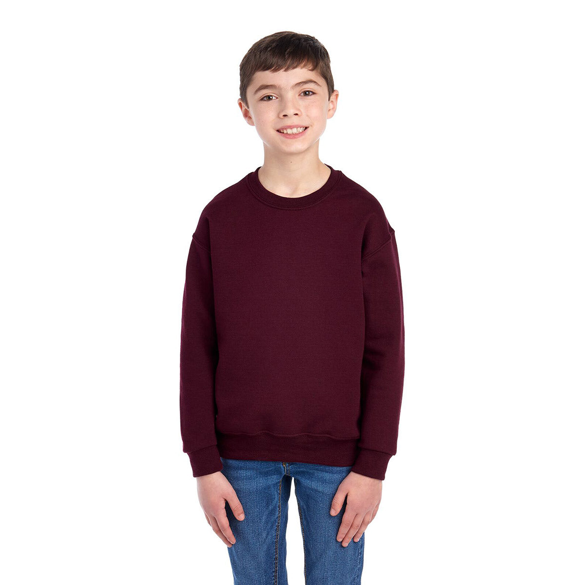 A youth model wearing a maroon Jerzees NuBlend® Youth Sweatshirt against a white background.