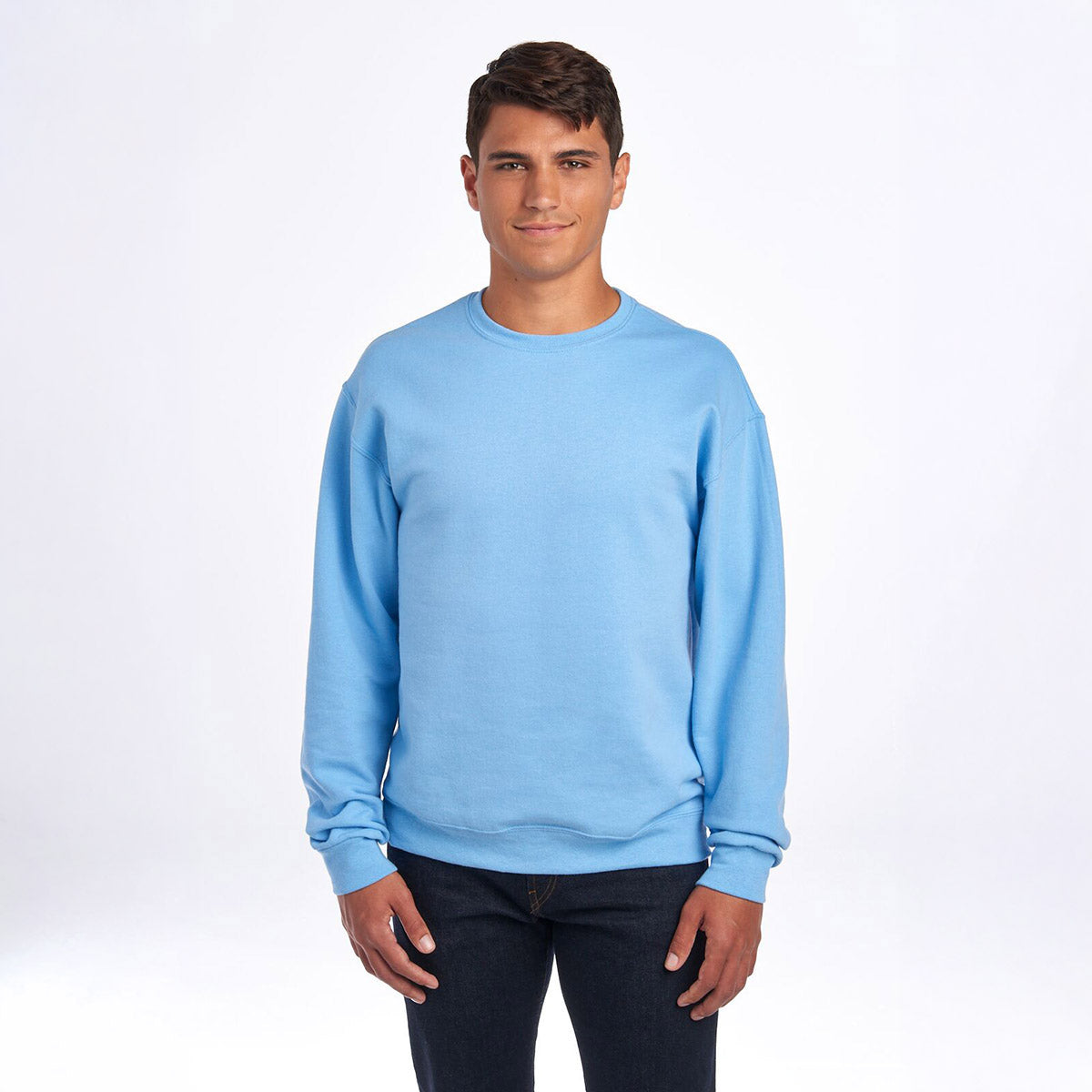 Male model wearing a light blue Jerzees NuBlend Adult Sweatshirt against a white background.