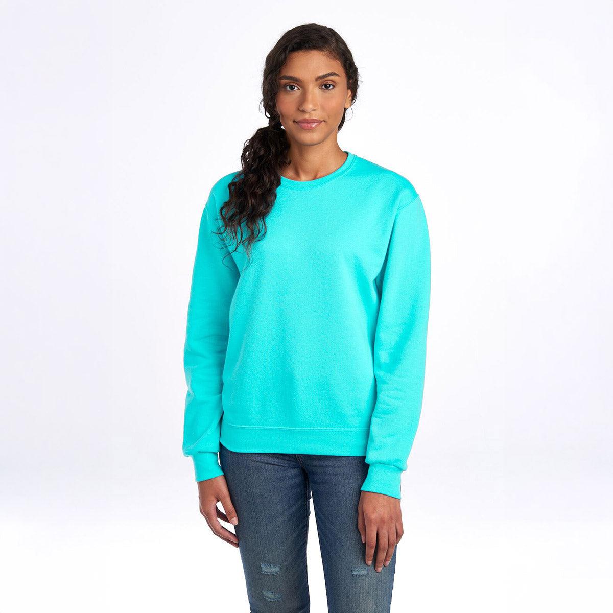 Model wearing a Jerzees NuBlend Adult Sweatshirt in Scuba Blue, featuring a crew neck and long sleeves.