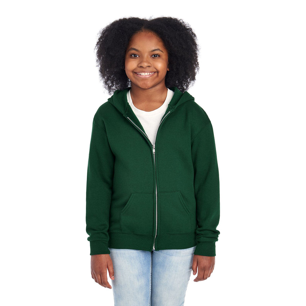 A young girl wearing a Forest Green Jerzees NuBlend® Youth Full-Zip Hooded Sweatshirt.