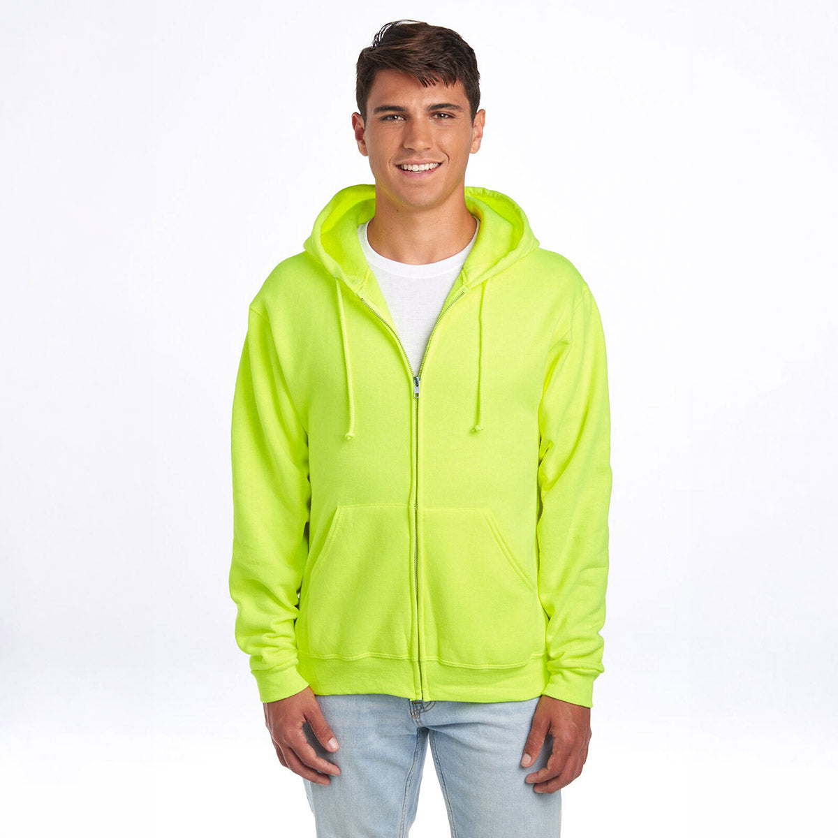 Young man wearing a safety green Jerzees NuBlend unisex full-zip hooded sweatshirt over a white t-shirt.