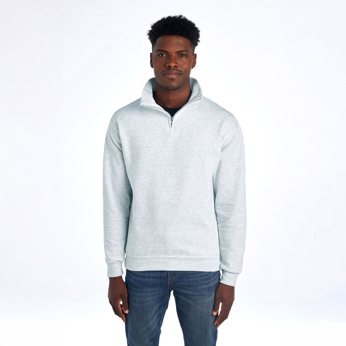 Jerzees NuBlend unisex quarter-zip cadet collar sweatshirt in ash worn by a man.
