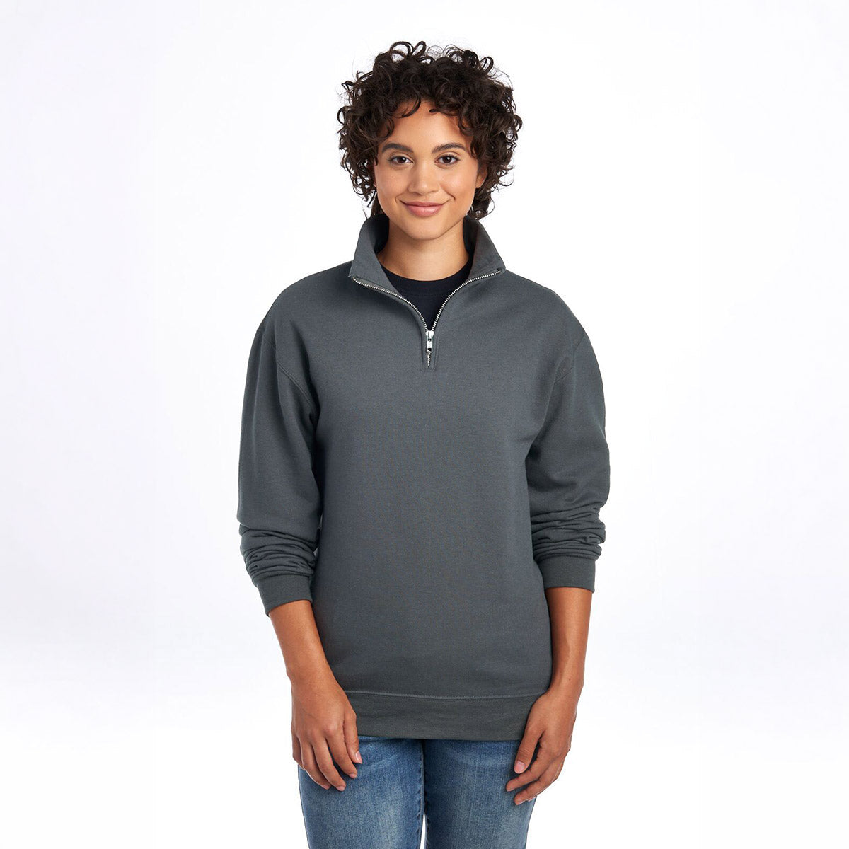 Model wearing a charcoal grey Jerzees NuBlend® unisex quarter-zip cadet collar sweatshirt.