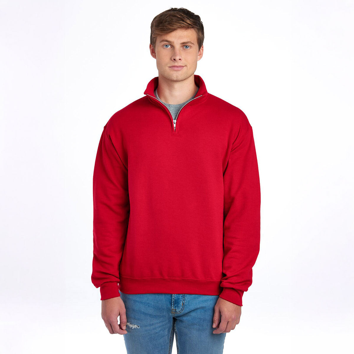 Man wearing a Jerzees NuBlend unisex true red quarter-zip cadet collar sweatshirt against a white background.