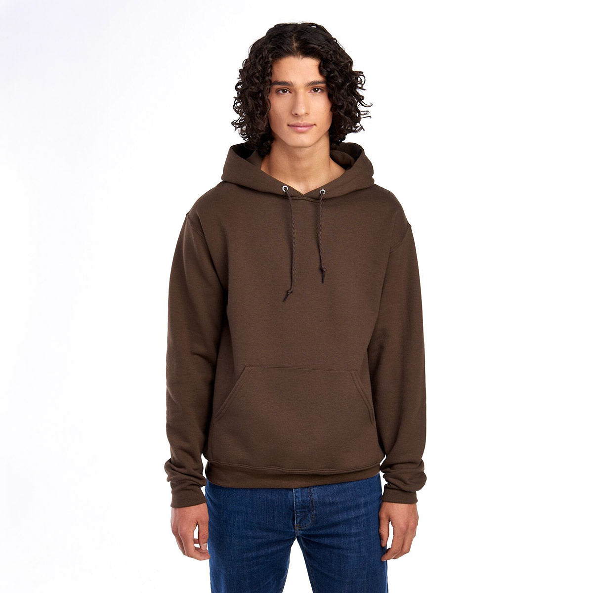 Model wearing a chocolate brown Jerzees NuBlend® unisex hooded sweatshirt.