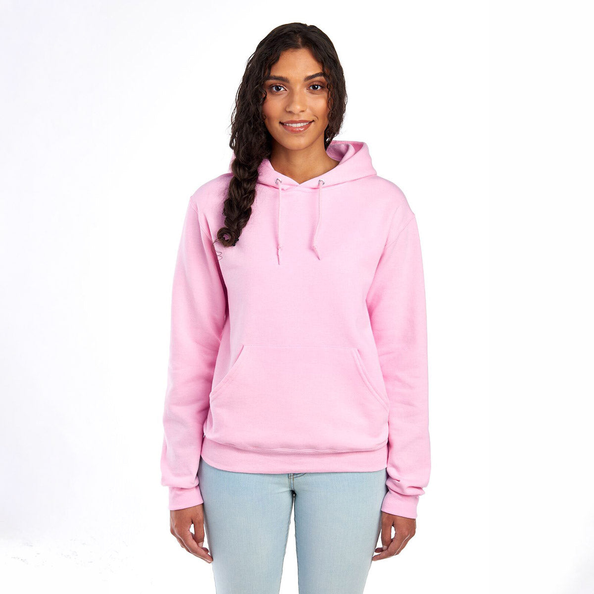 A smiling model wearing a Jerzees NuBlend® unisex hooded sweatshirt in classic pink.