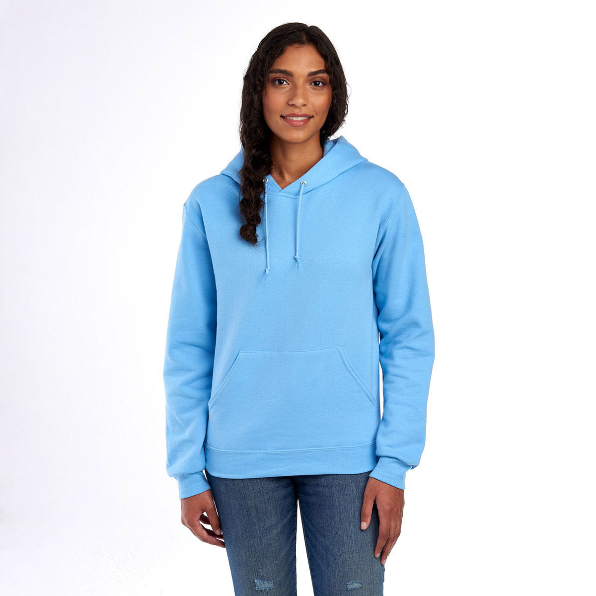A woman wearing a light blue Jerzees NuBlend unisex hooded sweatshirt.